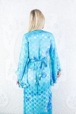 Venus Maxi Dress - Vintage Sari - Icy Aqua & Blue Rose Floral - Size M/L 8 Venus Maxi Dress - Vintage Sari - Icy Aqua & Blue Rose Floral - Size M/L -KIKIS Clothing Shop model wearing boho frilly bell sleeve maxi dress hippie long sleeve wrap dress handmade from recycled vintage 1970s indian sari by all about audrey 22