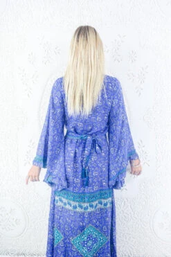 Venus Maxi Dress - Vintage Sari - Amethyst & Teal Illustrations - Size M/L -KIKIS Clothing Shop model wearing boho frilly bell sleeve maxi dress hippie long sleeve wrap dress handmade from recycled vintage 1970s indian sari by all about audrey 52