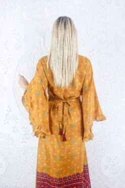 SALE Venus Maxi Dress - Vintage Sari - Mango Yellow Polka Dot Motif - Size L/XL 12 SALE Venus Maxi Dress - Vintage Sari - Mango Yellow Polka Dot Motif - Size L/XL -KIKIS Clothing Shop model wearing boho frilly bell sleeve maxi dress hippie long sleeve wrap dress handmade from recycled vintage 1970s indian sari by all about audrey 67
