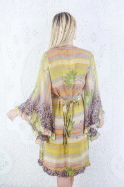 Venus Vintage Sari Midi Dress - Aztec Sun Bright Floral - Size L/XL -KIKIS Clothing Shop model wearing boho frilly bell sleeve midi dress hippie long sleeve short wrap dress handmade from recycled vintage 1970s indian sari by all about audrey 30