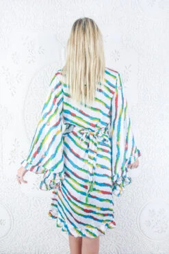 Venus Vintage Sari Midi Dress - Salt White & Stripe Embroidered Flowers - Size M/L 9 Venus Vintage Sari Midi Dress - Salt White & Stripe Embroidered Flowers - Size M/L -KIKIS Clothing Shop model wearing boho frilly bell sleeve midi dress hippie long sleeve short wrap dress handmade from recycled vintage 1970s indian sari by all about audrey 62