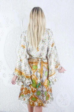 Venus Vintage Sari Midi Dress - Pearl White & Mustard Elephant Print - Size S/M -KIKIS Clothing Shop model wearing boho frilly bell sleeve midi dress hippie long sleeve short wrap dress handmade from recycled vintage 1970s indian sari by all about audrey 65