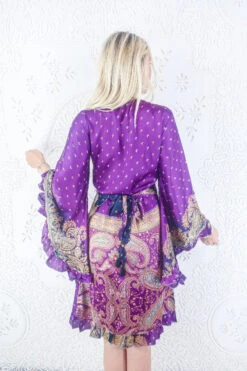 Venus Vintage Sari Midi Dress - Pansy Purple & Gold Ornate Paisley - Size M/L -KIKIS Clothing Shop model wearing boho frilly bell sleeve midi dress hippie long sleeve short wrap dress handmade from recycled vintage 1970s indian sari by all about audrey 89